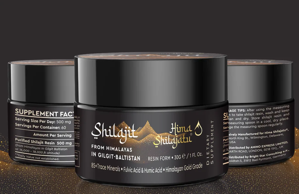 Three black jars of Hima Shilajatu shilajit resin on a dark surface dusted with gold, the Supplement Facts panel visible on the left jar