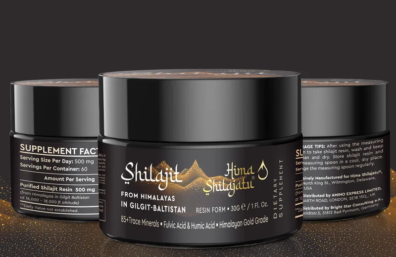 Three black jars of Hima Shilajatu shilajit resin on a dark surface dusted with gold, the Supplement Facts panel visible on the left jar